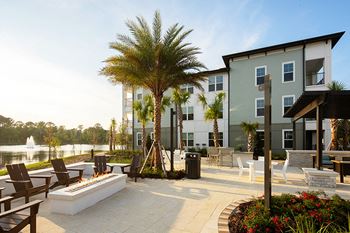 Drift Town Center East outdoor lounge area with BBQ grills